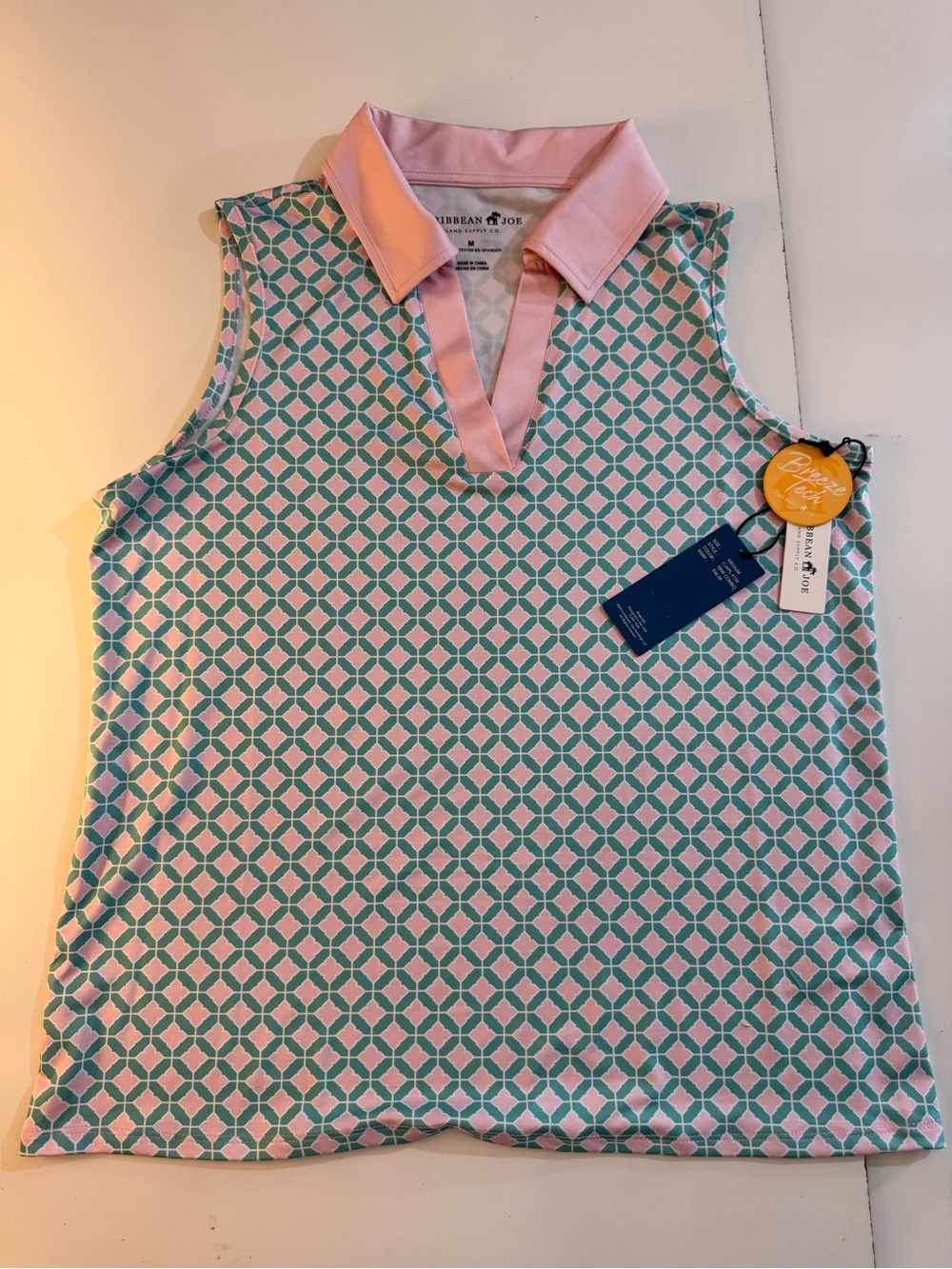 Caribbean Joe Pink-Collar Sleeveless Polo with Teal Geometric Pattern
